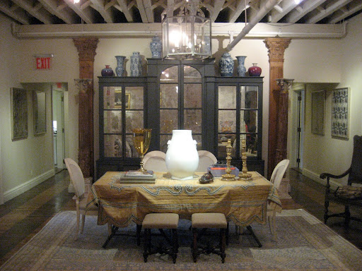 Welcome to Bunny Williams! As soon as you walk in you are greeted with rich details and a layering of styles.  I love the table covering - look at it's shaped edges.