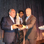 Ankur Jain Presents Award to Joseph Plumeri aboard Intrepid