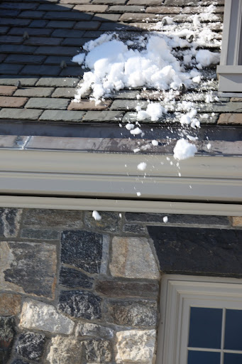 Please stay far away from the roof line, as snow has been avalanching off of it.