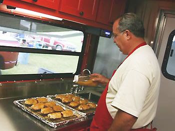 Joe getting his chicken ready to put on smoker.
