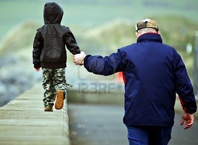 [7852334-father-and-son-walking-hand-in-hand%255B4%255D.jpg]