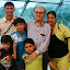 Foto tirada no dia 12 de julho de 2007 por ocasião do lançamento dos livros intitulados Formas de Linhas Espectrais em Gases Neutros, Plasmas Densos e Estabilidade Quiral (Autores: Bassalo e Mauro Sérgio Dorsa Cattani) e Ética e Atividade Científica (Autores: Robson Fernandes de Farias, Bassalo e José Edison Ferreira), ocorrido no Salão do Livro Universitário na 59a. Reunião da Sociedade Brasileira para o Progresso da Ciência (SBPC), no Hangar de Convenções do Estado do Pará. Da esquerda para a direita: Vítor Melo Bassalo, José Maria Coelho Bassalo, Lucas de Melo Bassalo, Matheus Bassalo Aflalo, Bassalo e Ádria Bassalo Aflalo.