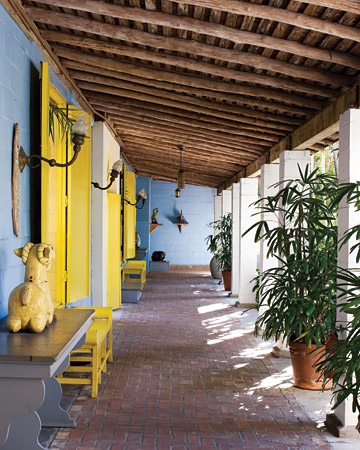 I love that these shutters were painted a canary yellow against the sky blue walls. (Martha Stewart Living) I love that these shutters were painted a canary yellow against the sky blue walls. (Martha Stewart Living)