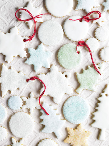 The cookies will be sturdier for hanging if you ice them with the royal icing. Try adding tiny amounts of food coloring to small bowls of the icing to make different colors. The cookies will be sturdier for hanging if you ice them with the royal icing. Try adding tiny amounts of food coloring to small bowls of the icing to make different colors.