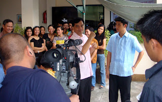 MCCID Deaf Trainor Lucky McGill Paltep is being interviewed by the media.