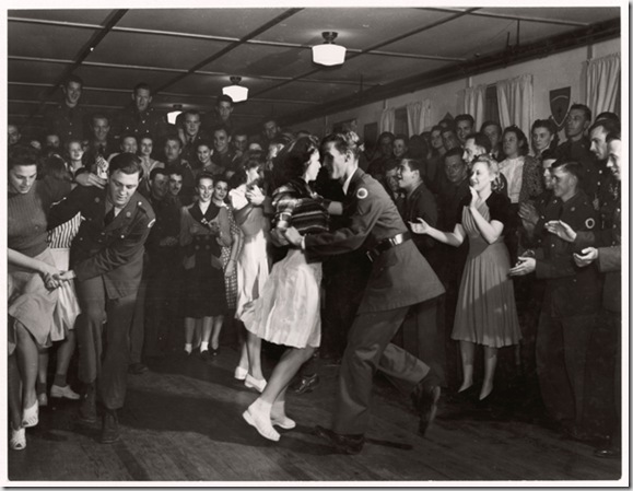 Soldiers at Camp Shelby military base dance with local girls.