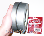 RingO from Babeland's Blow Job Expert Kit Around a Roll of Duct Tape