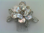 Regina B. has some of the best combs around. This mother of pearl flower one caught my eye.