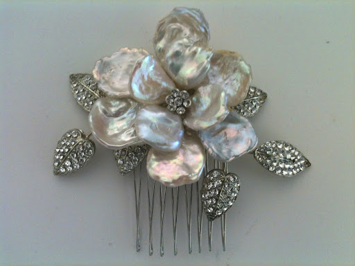 Regina B. has some of the best combs around. This mother of pearl flower one caught my eye.