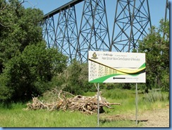 1662 Alberta Lethbridge - Helen Schuler Nature Centre sign with High Level Bridge in background
