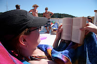 Kristy reading on the boat