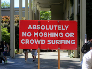 Sign at Bumbershoot: “Absolutely No Moshing or Crowd Surfing”