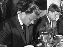 c0 Protestant Billy Graham (L) and Catholic John F Kennedy praying together in 1961