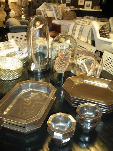 Geometric silver platters and bowls break up the usual circle-plate-norm.