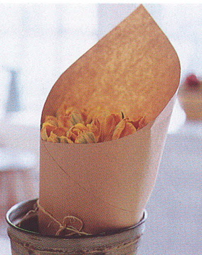 Wrap tulips in brown paper or newspaper, secure with twine or a rubber band, and place them in water overnight to keep them from drooping before you arrange them. This works well with any flowers that have a tendency to sway and fall. (The Best of Martha Stewart Living -- Arranging Flowers) Wrap tulips in brown paper or newspaper, secure with twine or a rubber band, and place them in water overnight to keep them from drooping before you arrange them. This works well with any flowers that have a tendency to sway and fall. (The Best of Martha Stewart Living -- Arranging Flowers)