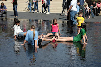 Kids playing in the fountains