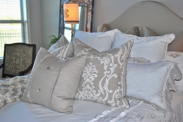 Upholstered headboard with curve and feminine pillows.jpg Upholstered headboard with curve and feminine pillows