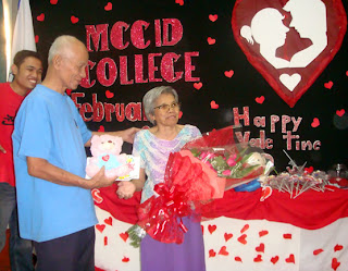 Sir Remberto Esposa presents gifts to February Birthday Celebrant Ma'am Remedios Esposa courtesy of MCCID Students.