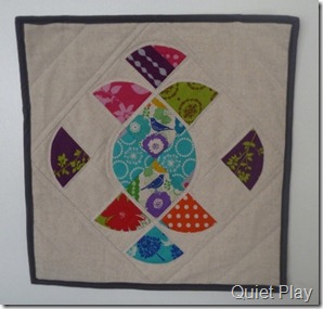 Ornate mini quilt in Echino and linen