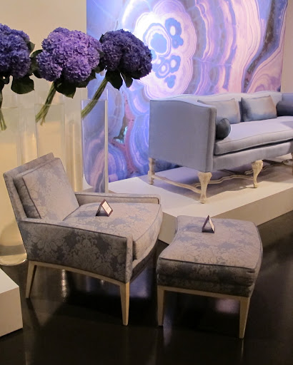 The clean lines of this Billy armchair and ottoman add to the purple arrangement.