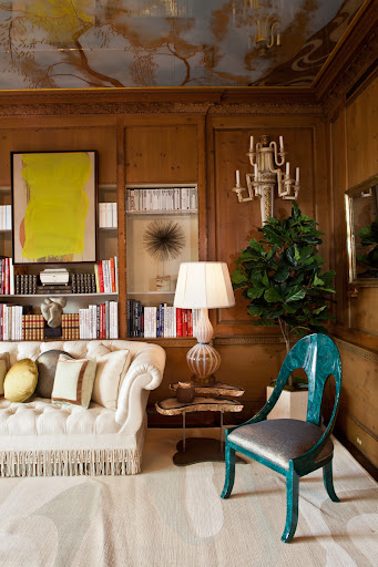 The sliced geode table is so unique -- especially combined with the tufted couch and vibrant painting. (Kemble Interiors, Inc.)