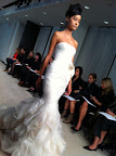 I love this dress with an asymmetric pleated bodice and cut organza blossom hem. It's amazing as it moves.