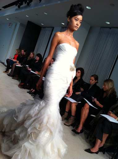 I love this dress with an asymmetric pleated bodice and cut organza blossom hem. It's amazing as it moves.