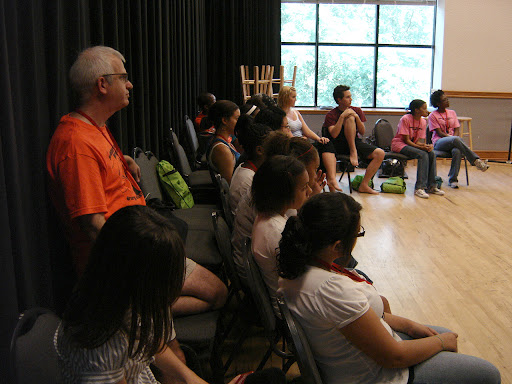 Dr. Bruce Cohen takes a break from the exercises with the kids to listen to Professor Westenberg. (photo credit: Sam Senovich)