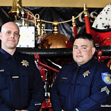 Per Sacramento Police Department, "On December 22, 2009, Officer Richard Kawasaki and Officer Matt Suehowicz were dispatched to a call of a vehicle that had hit a sound wall on Riverside Boulevard and was on fire. Officer Suehowicz arrived and saw the vehicle's front end and passenger compartment completely engulfed in flames. He grabbed his fire extinguisher and ran toward the vehicle. Officer Suehowicz discharged his fire extinguisher into the vehicle's interior. He then reached into the vehicle in an attempt to pull the driver out. The driver's legs were pinned and Officer Suehowicz was unable to pull him out. At this point, Officer Kawasaki arrived. Together, Officer Kawasaki and Officer Suehowicz tried to extract the driver from the burning vehicle as the fire was intensifying in both heat and size. The officers grabbed under the driver's arms and were eventually able to pull him out. They pulled the driver about 40 feet away from the vehicle and onto the sidewalk. As the News_101015_CSFAAwardsCeremony