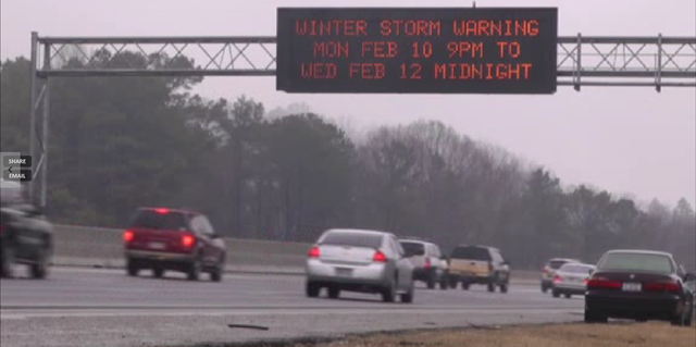A freeway sign in Georgia announces a winter storm warning for 10-12 February 2014.  President Obama declared a state of emergency in Georgia as the southern state awaited what the National Weather Service called a potentially 'crippling' ice and snow storm 'of historical proportions'. Photo: AP 