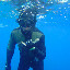 Ben da skin divah - Heres my buddy Ben in Lanai waters givin a shaka before he goes down...way down...whew!