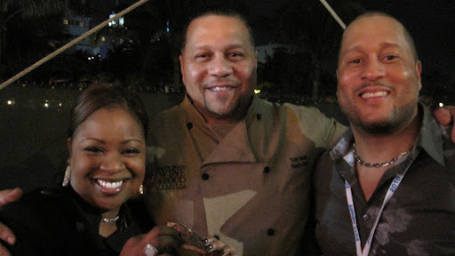 BBQ master Tony Neely (center) worked the table while brother Pat and sister-in-law Gina enjoyed a bite.