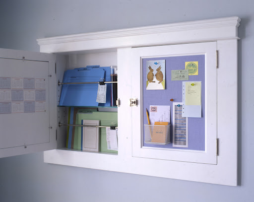 Two medicine cabinets can be outfitted as a office. The doors have been fitted with metal and homasote covered in linen to make a pin board and magnet board. Inside, files and supplies are stored. Two medicine cabinets can be outfitted as a office. The doors have been fitted with metal and homasote covered in linen to make a pin board and magnet board. Inside, files and supplies are stored.
