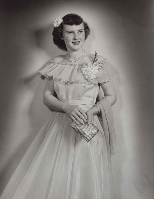 1940s full-length portrait of a young woman wearing a formal gown, photo by Strands Studio of Rugby, North Dakota