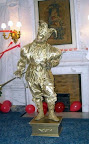 Gold Jester with a horn statue