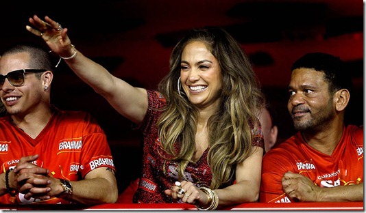 Jennifer Lopez greets people as she watches the parade at the Sambadrome in Rio de Janeiro. (Victor R. Caivano/Associated Press)