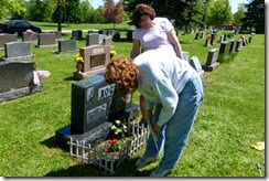 Gayle and Ruth Ann decorating Ken's grave