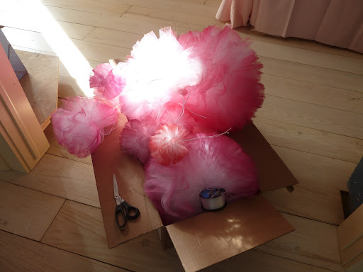 Here, the afternoon light making the poms moody before we added them to the door frame.
