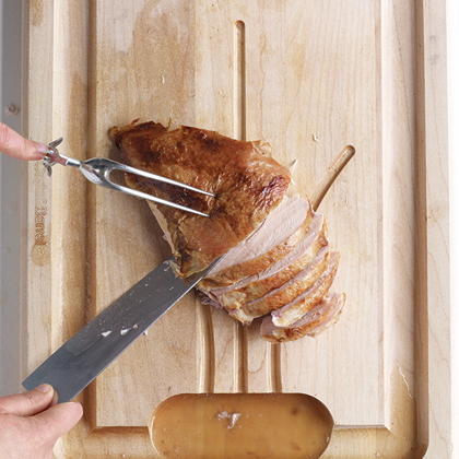 Slice breasts crosswise, skin side up, and arrange on a platter with dark meat and wings. Scoop stuffing from cavity. Slice breasts crosswise, skin side up, and arrange on a platter with dark meat and wings. Scoop stuffing from cavity.