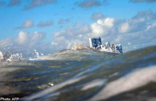Ocean waves and skyscrapers. AFP