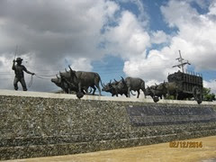 Statue of oxen pulling sugar cane wagon