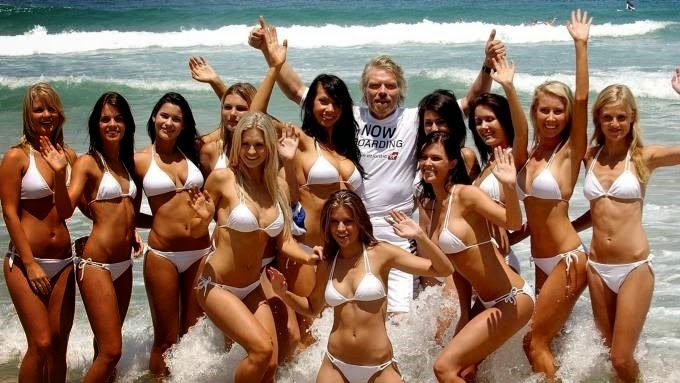 Richard Branson with bikini babes