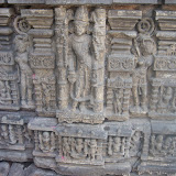 Shown with four hands, carrying akshamala, kamandalu in lower hands. Upper hands carrying ankush? and lotus stem. Who it could be?