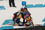 Canadian and American skiiers embracing after a tough ski