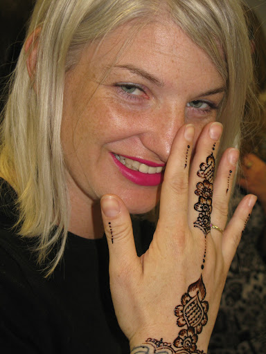 Naomi proudly displays the completed work.