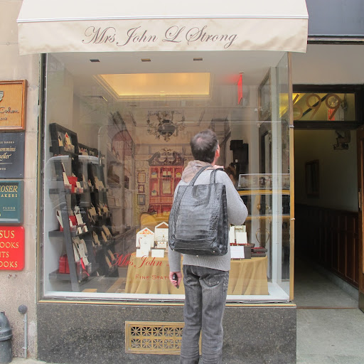 Arriving at the Madison Avenue storefront. Mrs. John L. Strong first opened a woman's dress shop before transitioning into a letterpress business.