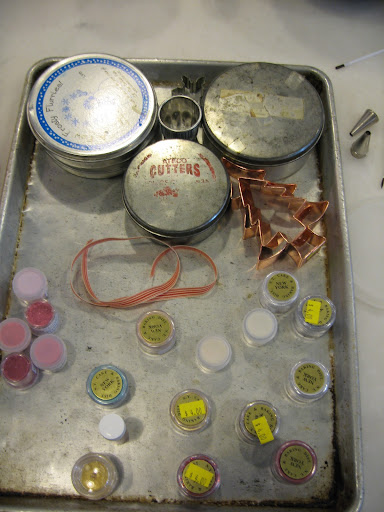 These are different sets of cookie cutters and some of the many luster dust colors that I used.