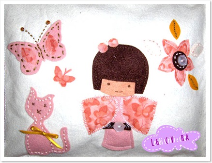 appliquè di pannolenci con kokeshi