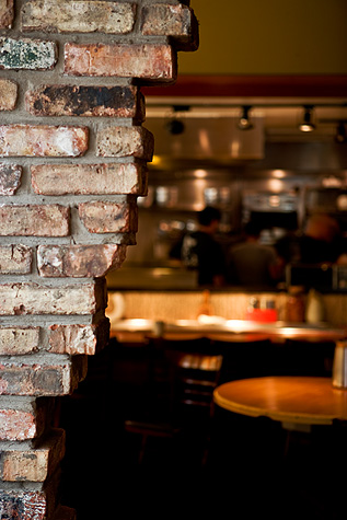 A view through the wall that separates the Sake Bar from the restaurant