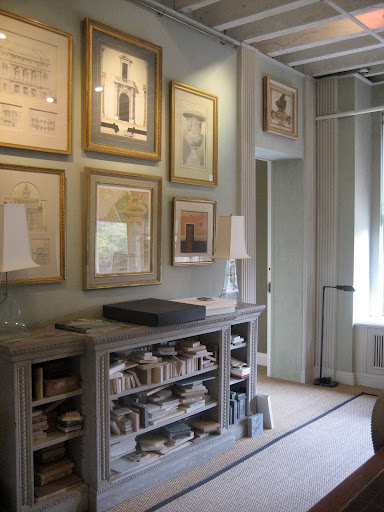 Inside the conference room is a bookcase filled with marble samples.